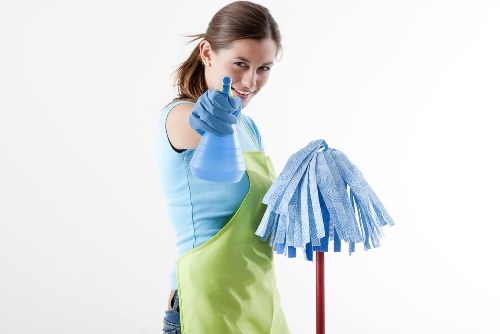 Cleaner using safe working practices in a prepared workspace
