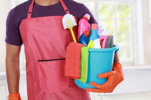 Professional carpet cleaner in Belsizepark restoring a living room carpet